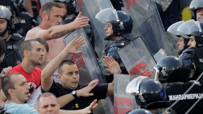 Red Star soccer fans clash with police during their Serbian national soccer league derby match against Partizan, in Belgrade, Serbia, Saturday, May 5, 2012, in Belgrade, Serbia. Red Star won 1-0. (AP Photo/Darko Vojinovic)