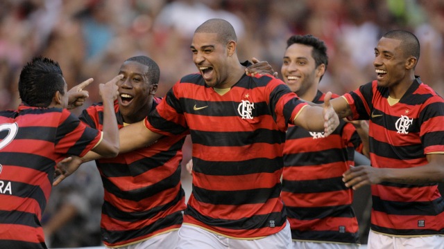 Flamengo's Adriano celebrates with teammates after scoring against Atletico Paranaense during a Brazilian championship soccer match at the Maracana stadium in Rio de Janeiro, Saturday, May 31, 2009. (AP Photo/ Ricardo Moraes)