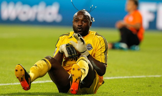 Congolese soccer club TP Mazembe's goalkeeper Muteba Kidiaba celebrates winning against Mexican Pachuca club in their FIFA Club World Cup qualifying soccer match at the Mohammed Bin Zayed Stadium in Abu Dhabi, UAE, Friday, Dec. 10, 2010. (AP Photo/Hassan Ammar)