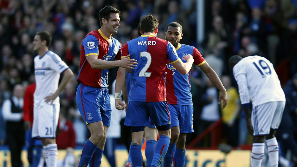 Jogadores do Crystal Palace comemoram a vit&oacute;ria contra o Chelsea (AP Photo/Sang Tan)