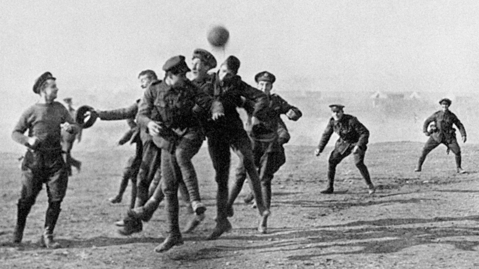 ON CHRISTMAS DAY HOSTILITIES CEASED IN FAVOUR OF FOOTBALL. HERE OFFICERS AND MEN OF THE 26TH DIVISIONAL TRAIN, A.S.C. ENJOY A GAME AT SALONIKA,  GREECE,  DURING THE FIRST WORLD WAR.