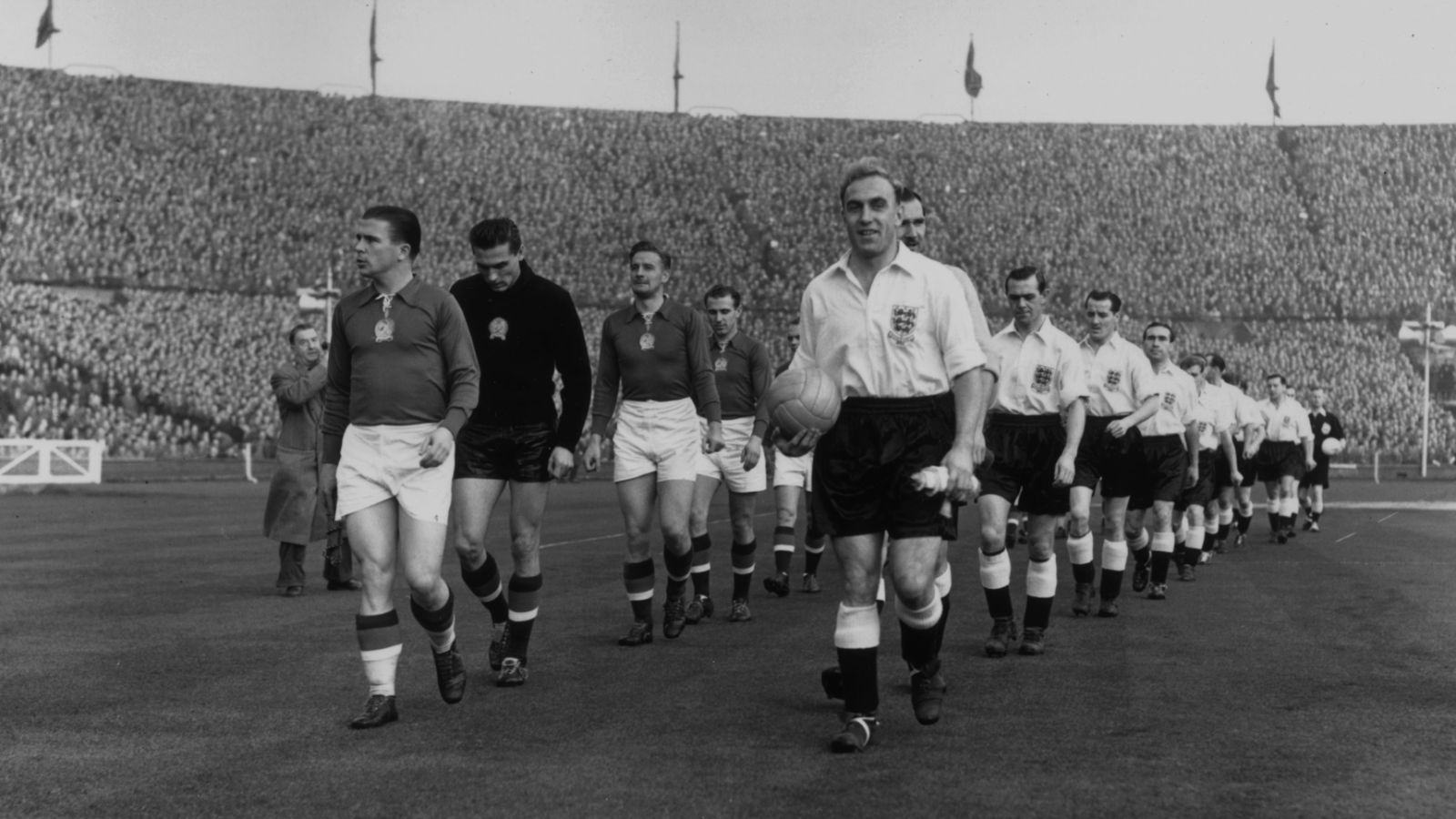 The English and Hungarian captains, Ferenc Puskas (left) and Billy Wright leading out their teams before a game at Wembley Stadium, London. (Photo by William G Vanderson/Getty Images)