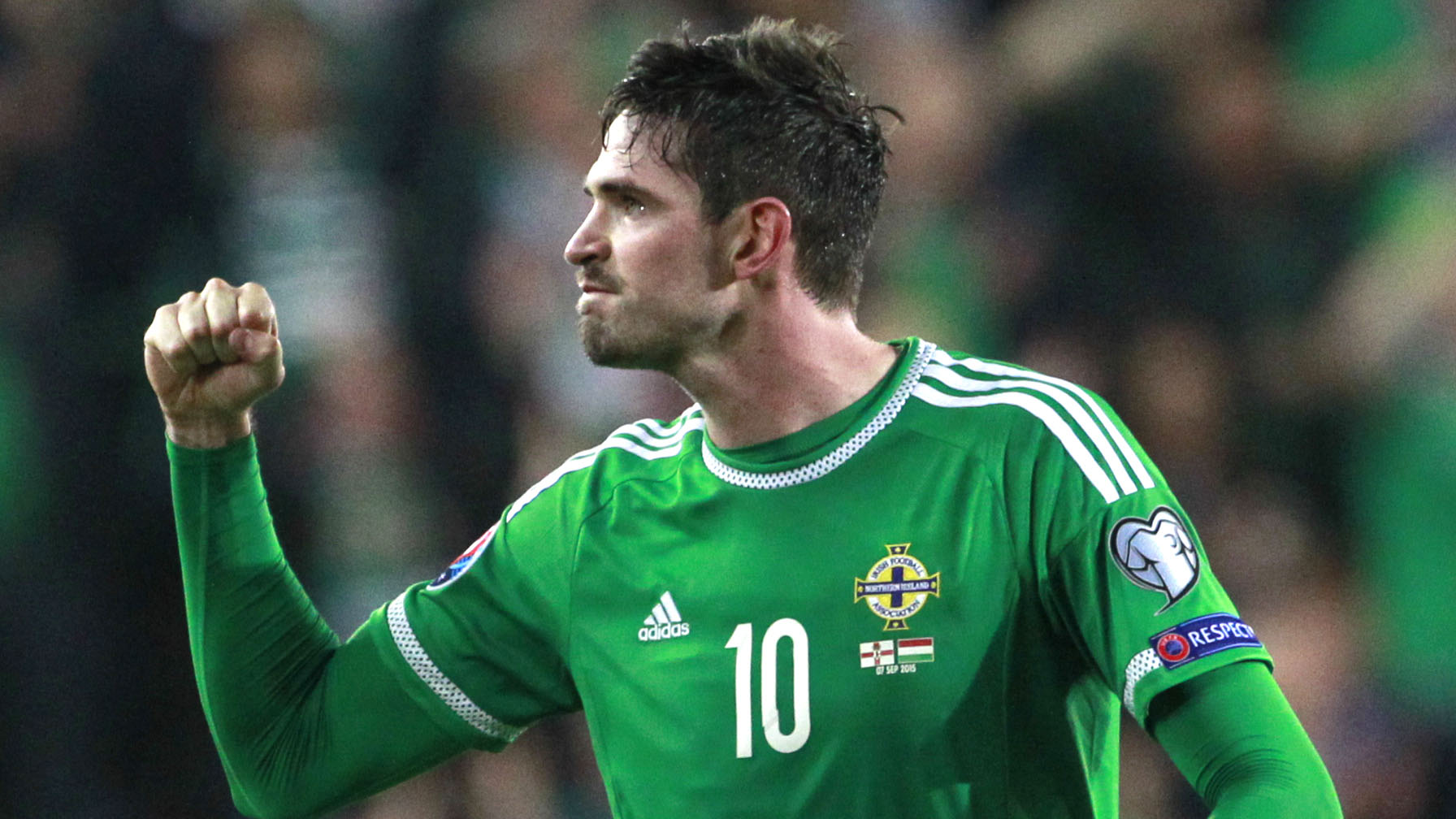 Northern Ireland's Kyle Lafferty celebrates at full time following his goal against Hungary during their Euro 2016 Group F qualifying soccer match at Windsor Park, Belfast, Northern Ireland, Monday, Sept. 7, 2015. (AP Photo/Peter Morrison)