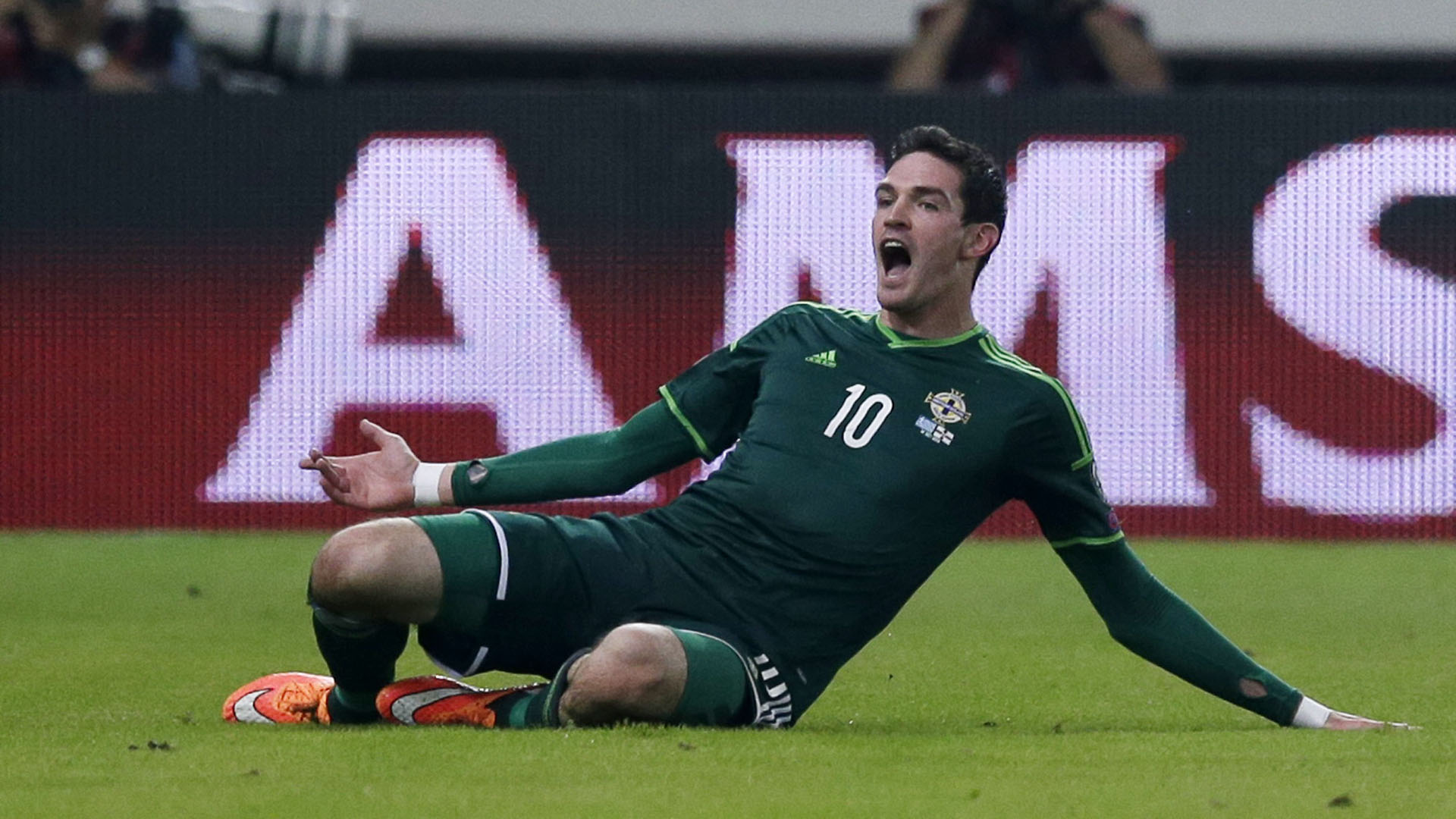 Northern Ireland's Kyle Lafferty celebrates after scoring the second goal of his team against Greece during the Group F Euro 2016 qualifying soccer match at the Georgios Karaiskakis stadium, in the port of Piraeus, near Athens on Tuesday, Oct. 14, 2014. (AP Photo/Thanassis Stavrakis)