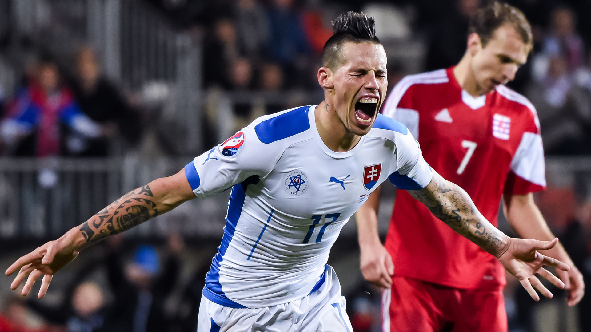 Slovakia's Marek Hamsik, left, celebrates after scoring during a Group C Euro 2016 qualifying soccer match between Luxembourg and Slovakia at the Josy Barthel stadium in Luxembourg on Monday, Oct. 12, 2015. (AP Photo/Geert Vanden Wijngaert)