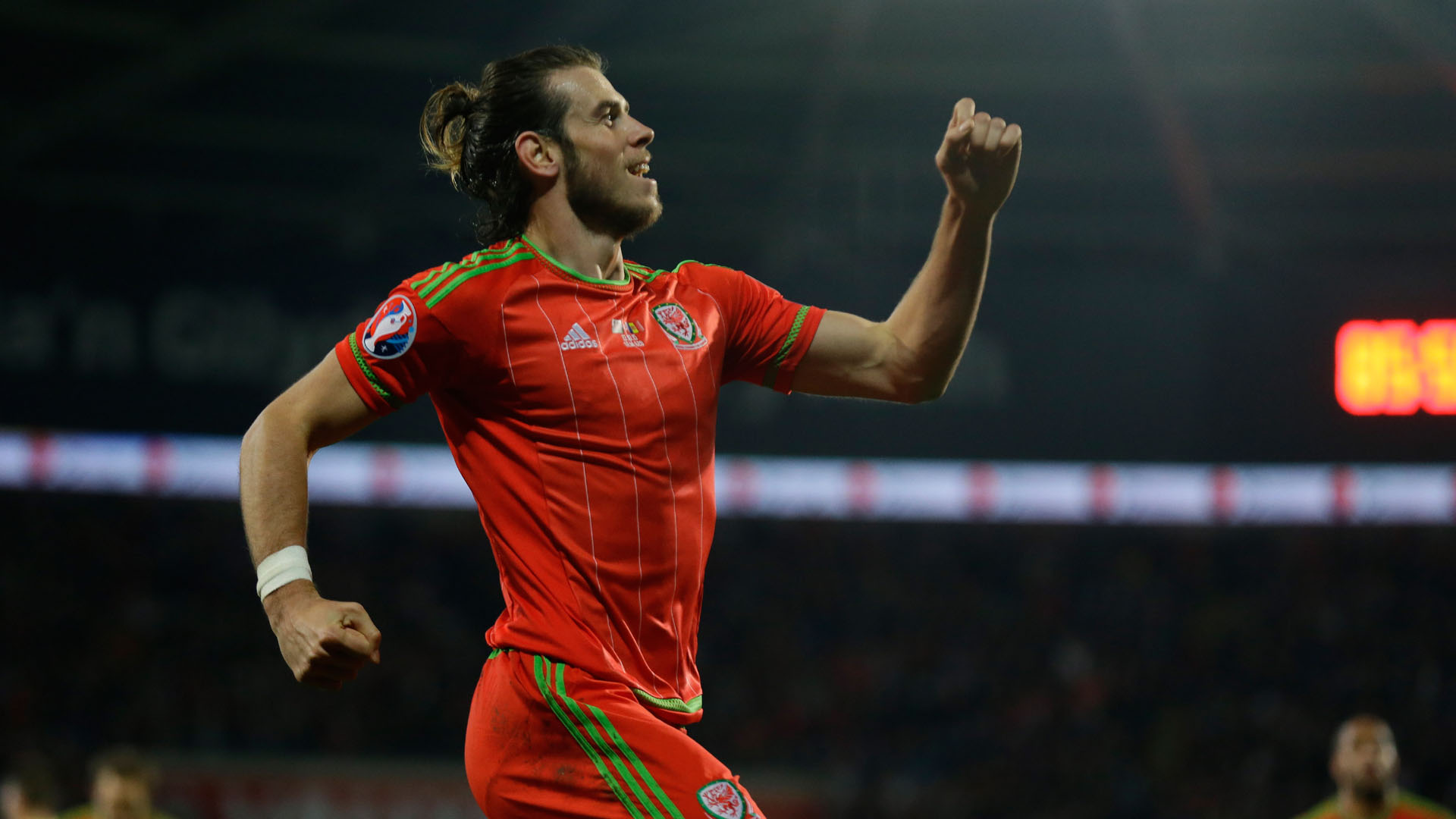 Wales' Gareth Bale celebrates scoring his side's second goal during the Euro 2016 Group B soccer match between Wales and Andorra at Cardiff City stadium in Cardiff, Tuesday, Oct. 13, 2015. (AP Photo/Matt Dunham)