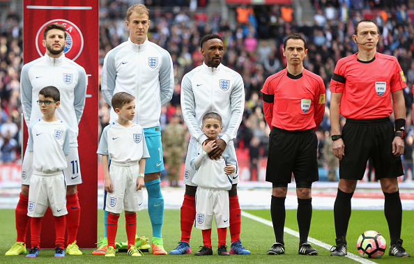 LONDON, ENGLAND - MARCH 26: Jermaine Defoe of England and England mascot Bradley Lowery (c) line up prior to the FIFA 2018 World Cup Qualifier between England and Lithuania at Wembley Stadium on March 26, 2017 in London, England. (Photo by Alex Morton - The FA/The FA via Getty Images)