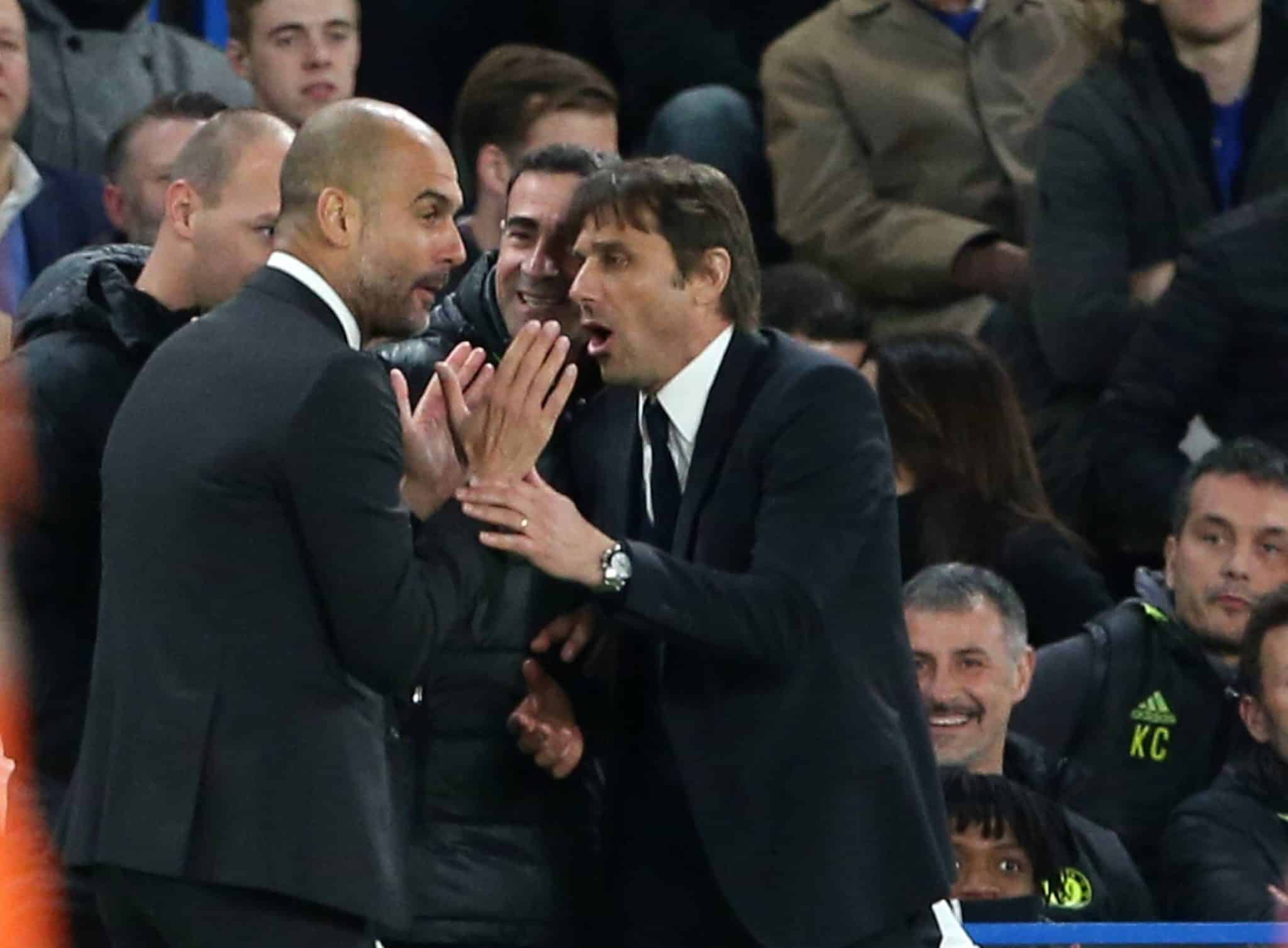 Chelsea s Antonio Conte tussles with Manchester City s Pep Guardiola during the Premier League match